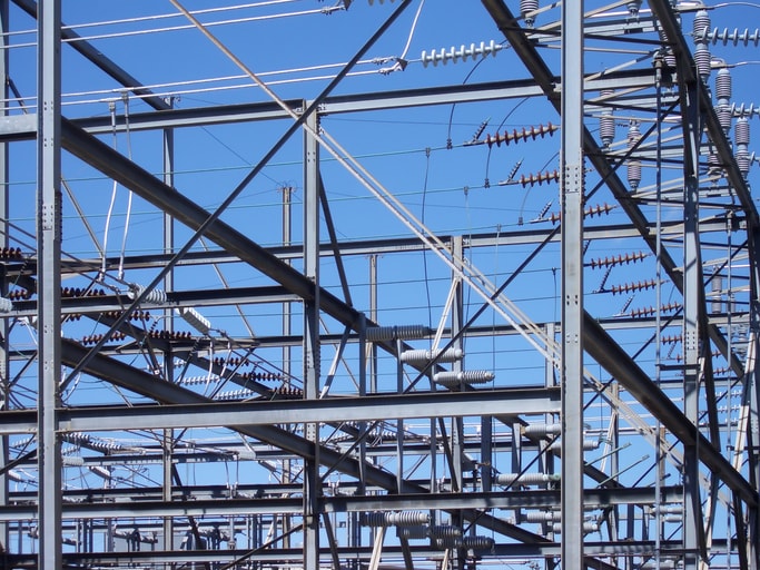 Electrical substation equipment against a blue sky